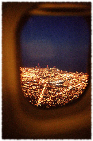 Travel-View-Of-City-Lights-Outside-Of-Plane-Window
